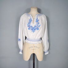 Load image into Gallery viewer, 70s WHITE HUNGARIAN FOLK BLOUSE WITH BLUE FLORAL EMBROIDERY - S
