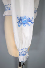 Load image into Gallery viewer, 70s WHITE HUNGARIAN FOLK BLOUSE WITH BLUE FLORAL EMBROIDERY - S
