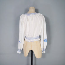 Load image into Gallery viewer, 70s WHITE HUNGARIAN FOLK BLOUSE WITH BLUE FLORAL EMBROIDERY - S