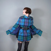 Load image into Gallery viewer, 70s JIMMY HOURIHAN "BORU" LIGHT BLUE, PINK AND GREEN PLAID WOOL CAPE - S-M