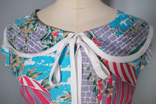 Load image into Gallery viewer, 50s PINK AND GREY FULL SKIRTED NOVELTY DRESS WITH BEACH AND CAFE WINDOW SCENE - S