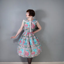 Load image into Gallery viewer, 50s PINK AND GREY FULL SKIRTED NOVELTY DRESS WITH BEACH AND CAFE WINDOW SCENE - S