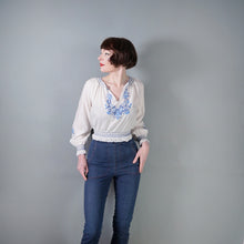 Load image into Gallery viewer, 70s WHITE HUNGARIAN FOLK BLOUSE WITH BLUE FLORAL EMBROIDERY - S