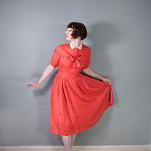 Load image into Gallery viewer, 40s CORAL SILKY RAYON TEA DRESS WITH BOW AND PETER PAN COLLAR - M
