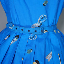 Load image into Gallery viewer, 50s BLUE WHIMSICAL NOVELTY PRINT DRESS WITH FULL SKIRT AND SHAWL NECK - S