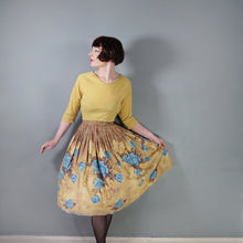 Load image into Gallery viewer, 50s NOVELTY MILLWORTH "VIE EN ROSE" BLUE ROSE AND GLASS VASE FLORAL PRINT BORDER FULL SKIRT - 26.5"