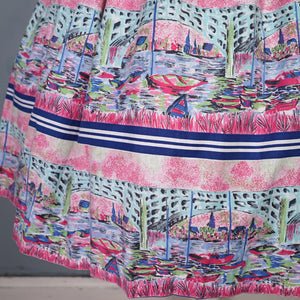 50s PINK NOVELTY SCENIC HARBOUR AND BOATS PRINT FULL SKIRT -26-27"