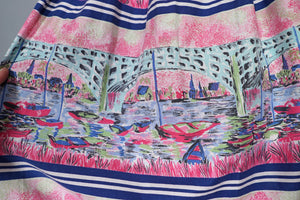 50s PINK NOVELTY SCENIC HARBOUR AND BOATS PRINT FULL SKIRT -26-27"