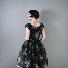 Load image into Gallery viewer, 50s BETTY LO BLACK FLORAL DRESS WITH FULL SKIRT AND SHELF BUST - M