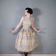 Load image into Gallery viewer, 50s SAMBO FASHIONS LIGHT BROWN BORDER PRINT FULL SKIRTED SUN DRESS - XS-S