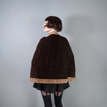 Load image into Gallery viewer, 60s 70s BROWN AND TAN SUEDE FESTIVAL CAPE WITH PUNCHED PATTERNS - S