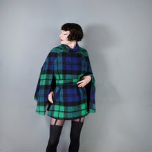 Load image into Gallery viewer, 70s JIMMY HOURIHAN BLACK BLUE AND GREEN PLAID WOOL CAPE WITH BELT - S-M