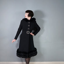 Load image into Gallery viewer, 60s BLACK WOOL COAT BY SIDWALL WITH CELTIC BUCKLE AND SHEEPSKIN HOOD - M