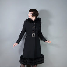 Load image into Gallery viewer, 60s BLACK WOOL COAT BY SIDWALL WITH CELTIC BUCKLE AND SHEEPSKIN HOOD - M