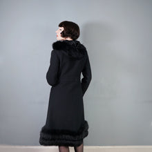 Load image into Gallery viewer, 60s BLACK WOOL COAT BY SIDWALL WITH CELTIC BUCKLE AND SHEEPSKIN HOOD - M