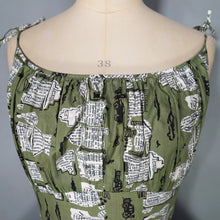 Load image into Gallery viewer, 50s OLIVE GREEN NOVELTY NEWSPAPER AND CARS PRINT STRAPPY SUN DRESS - XS