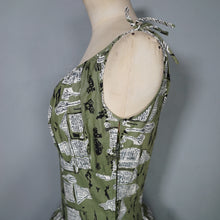 Load image into Gallery viewer, 50s OLIVE GREEN NOVELTY NEWSPAPER AND CARS PRINT STRAPPY SUN DRESS - XS