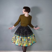 Load image into Gallery viewer, 50s 60s NOVELTY BLACK AND GREEN PEOPLE ART BORDER PRINT FULL SKIRT - 25"