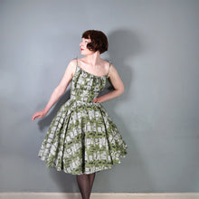 Load image into Gallery viewer, 50s OLIVE GREEN NOVELTY NEWSPAPER AND CARS PRINT STRAPPY SUN DRESS - XS