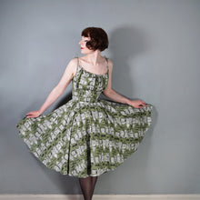 Load image into Gallery viewer, 50s OLIVE GREEN NOVELTY NEWSPAPER AND CARS PRINT STRAPPY SUN DRESS - XS