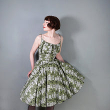 Load image into Gallery viewer, 50s OLIVE GREEN NOVELTY NEWSPAPER AND CARS PRINT STRAPPY SUN DRESS - XS