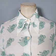 Load image into Gallery viewer, 70s GREEN AND WHITE SEMI SHEER ART DECO LADY FACE PRINT NOVELTY SHIRT - S