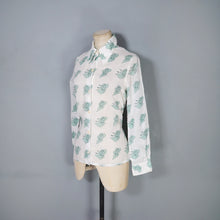 Load image into Gallery viewer, 70s GREEN AND WHITE SEMI SHEER ART DECO LADY FACE PRINT NOVELTY SHIRT - S