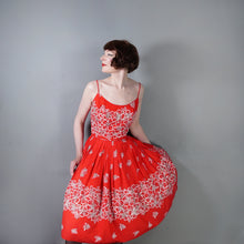 Load image into Gallery viewer, 60s "ALU LOLE" BRIGHT RED WHITE AND GOLD FLORAL HAWAIIAN FULL SKIRTED SUN DRESS - S