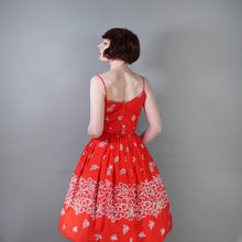 Load image into Gallery viewer, 60s "ALU LOLE" BRIGHT RED WHITE AND GOLD FLORAL HAWAIIAN FULL SKIRTED SUN DRESS - S