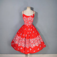 Load image into Gallery viewer, 60s "ALU LOLE" BRIGHT RED WHITE AND GOLD FLORAL HAWAIIAN FULL SKIRTED SUN DRESS - S