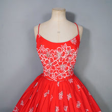 Load image into Gallery viewer, 60s "ALU LOLE" BRIGHT RED WHITE AND GOLD FLORAL HAWAIIAN FULL SKIRTED SUN DRESS - S