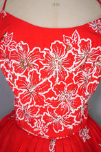Load image into Gallery viewer, 60s "ALU LOLE" BRIGHT RED WHITE AND GOLD FLORAL HAWAIIAN FULL SKIRTED SUN DRESS - S