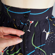 Load image into Gallery viewer, 70s 80s BLACK NOVELTY BAR SCENE BORDER PRINT SKIRT WITH LADIES WITH COCKTAILS - 27"