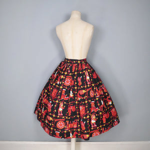 50s NOVELTY SKIRT IN BLACK AND RED WITH ORNAMENT / FIGURINE PRINT - 26"