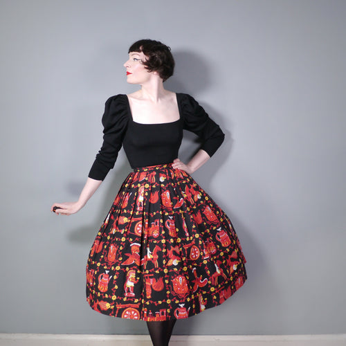 50s NOVELTY SKIRT IN BLACK AND RED WITH ORNAMENT / FIGURINE PRINT - 26