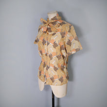 Load image into Gallery viewer, 70s SMOKING DECO LADY NOVELTY PRINT ORANGE PUSSYBOW SHIRT BLOUSE - S-M