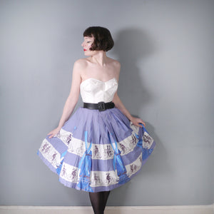 50s LIGHT BLUE NOVELTY SKIRT WITH DUTCH WINDMILLS AND CYCLISTS - 26"