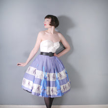 Load image into Gallery viewer, 50s LIGHT BLUE NOVELTY SKIRT WITH DUTCH WINDMILLS AND CYCLISTS - 26&quot;