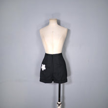 Load image into Gallery viewer, 60s / 70s HIGH WAISTED BLACK MINI SHORTS WITH FLORAL PATCH POCKET - 26&quot;