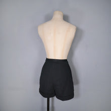 Load image into Gallery viewer, 60s / 70s HIGH WAISTED BLACK MINI SHORTS WITH FLORAL PATCH POCKET - 26&quot;