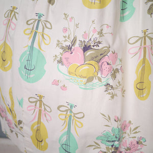 50s PASTEL NOVELTY SKIRT WITH BUTTERFLIES, MANDOLINS AND FRUIT BASKETS - 24"