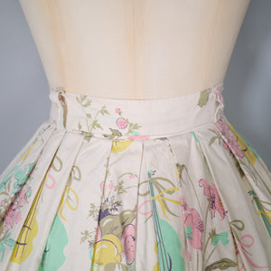 50s PASTEL NOVELTY SKIRT WITH BUTTERFLIES, MANDOLINS AND FRUIT BASKETS - 24"