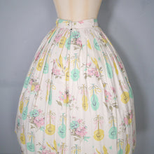 Load image into Gallery viewer, 50s PASTEL NOVELTY SKIRT WITH BUTTERFLIES, MANDOLINS AND FRUIT BASKETS - 24&quot;