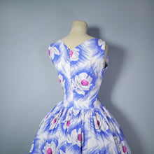 Load image into Gallery viewer, 50s BLUE WHITE FLORAL COTTON DAY DRESS WITH ASYMMETRIC NECKLINE AND BOW - S