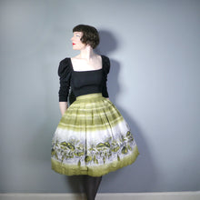 Load image into Gallery viewer, OLIVE GREEN 50s NOVELTY CITY MARKET SCENE BORDER PRINT SKIRT - 28&quot;