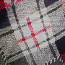 Load image into Gallery viewer, 50s RED BLACK AND WHITE TARTAN FULL CIRCLE SKIRT WITH TROMP L&#39;OEIL TASSLE HEM - 25.5&quot;