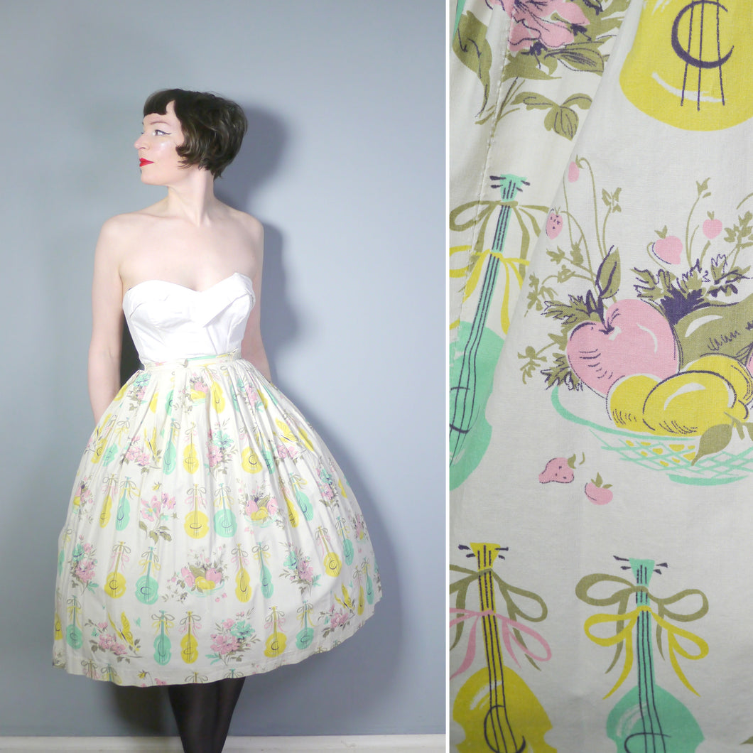50s PASTEL NOVELTY SKIRT WITH BUTTERFLIES, MANDOLINS AND FRUIT BASKETS - 24